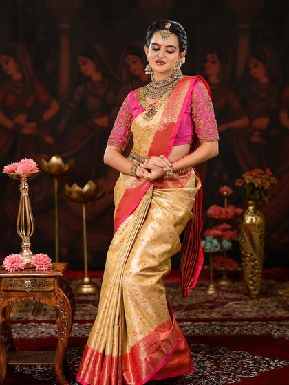 Another elegant pose showcasing the flow of the saree. The makeup is set to last, ensuring the bride looks flawless from every angle.