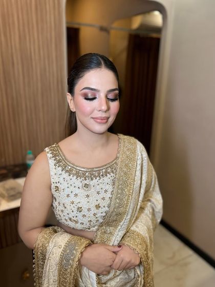 Eyes closed to show the soft, shimmery eyeshadow. It's a look that's both pretty and sophisticated.