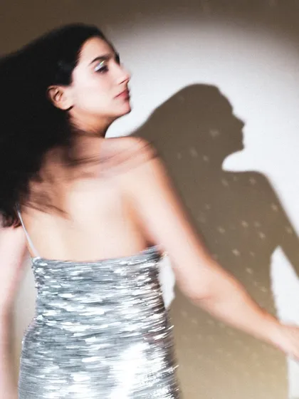 A dynamic, motion-filled shot from a birthday celebration. The movement and shadow play create a feeling of energy and freedom.