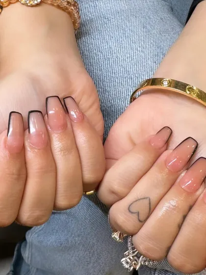 A modern classic that's always in style. This is my take on the outlined French manicure, featuring a clean, sheer nude base and a crisp black border on coffin-shaped nails.