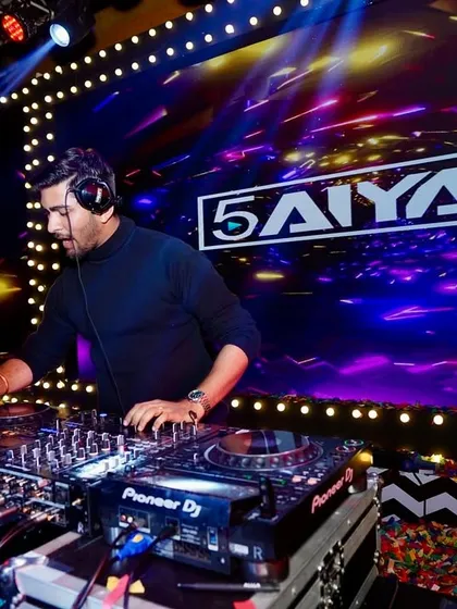 At the console with my logo lit up, fully focused on the mix. A great party is built on a seamless flow of music that builds throughout the night.