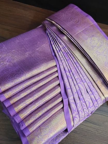 The final box-folded lavender saree, ready to be shipped internationally.