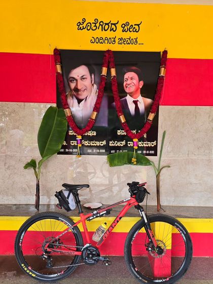 A tribute to Dr. Rajkumar and Puneeth Rajkumar seen along the Rajyotsava ride route. Our rides are deeply connected to the culture and icons of Karnataka.