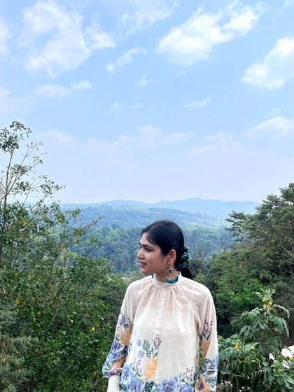 A candid moment enjoying the fresh air and beautiful view. My travels are as much about quiet contemplation as they are about exploration.