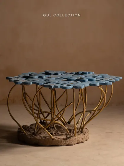 This is our Gul Table, inspired by a bouquet of flowers. The challenge was to capture the imperfect beauty of aging blooms, with each concrete petal uniquely positioned and supported by cast brass stems. It transforms any living space into a gallery of art.