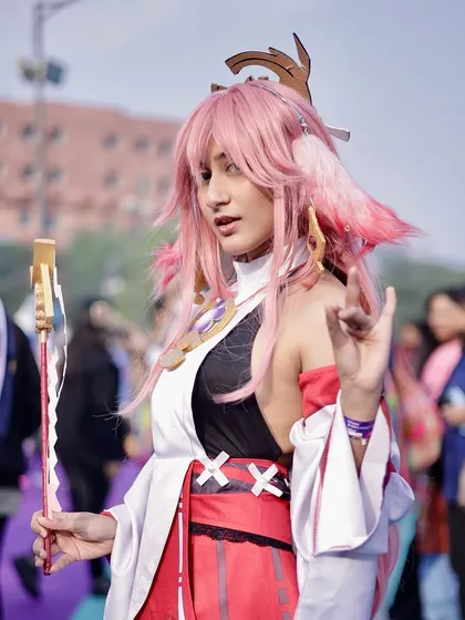 A cosplayer strikes a pose in the middle of the event grounds. I capture both posed portraits and candid moments to tell the full story of the convention.