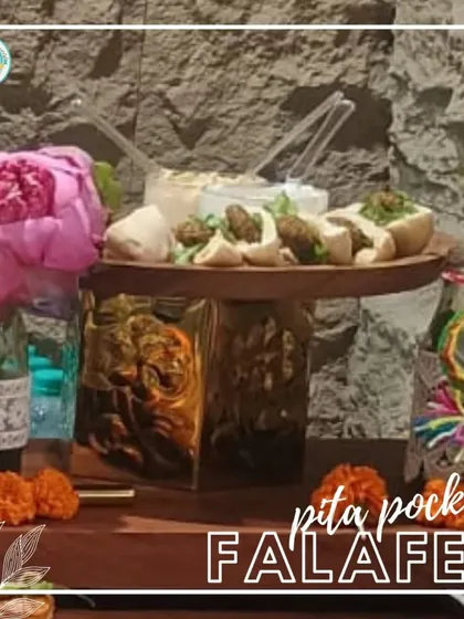 My Pita Pockets with Falafel are a great handheld option for parties. Here they are displayed on a rustic wooden stand, making them an attractive and easy-to-eat appetizer for guests.