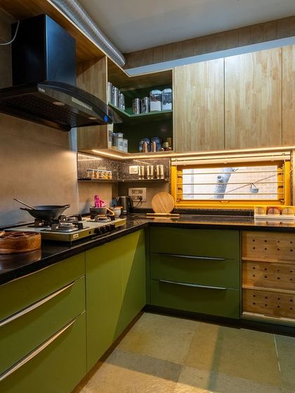 A full view of the L-shaped kitchen layout at Audumbara, designed for an efficient workflow with ample counter space and storage.