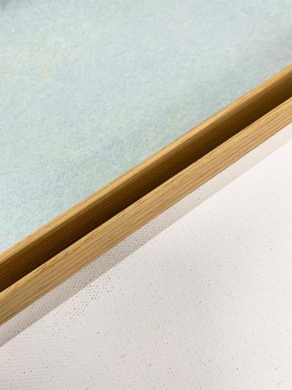 A close-up of the floater frame style used for the "Dusty Splash" abstract series, showing the gap that creates a floating effect.