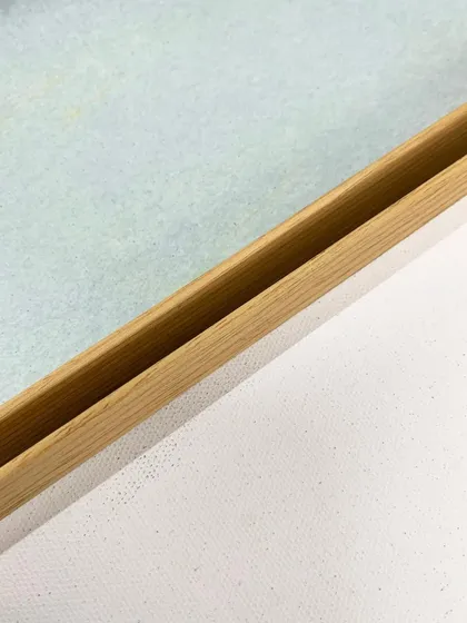 A close-up of the floater frame style used for the "Dusty Splash" abstract series, showing the gap that creates a floating effect.