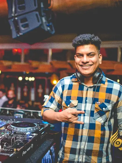 All smiles during my set at Opa Bar & Cafe. A happy DJ means a happy dancefloor, and I always bring positive energy to my performances.