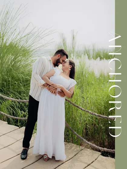 A beautifully composed portrait with an "Anchored" text overlay, symbolizing the couple's strong connection.
