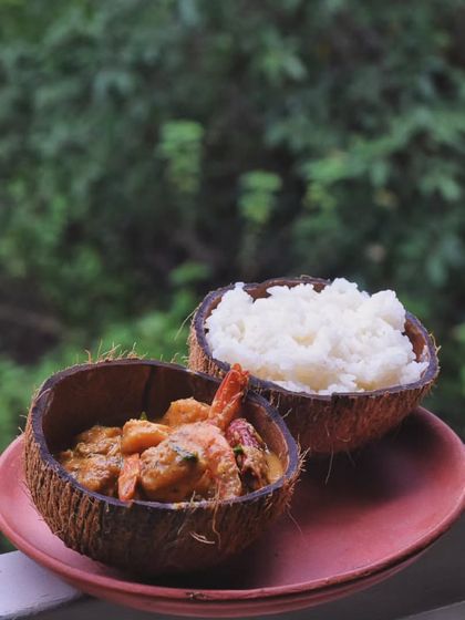 A simple and comforting Kerala-style Prawns Coconut Curry, served with steamed rice. This dish is perfect for a monsoon day, with its creamy texture and gentle spices.