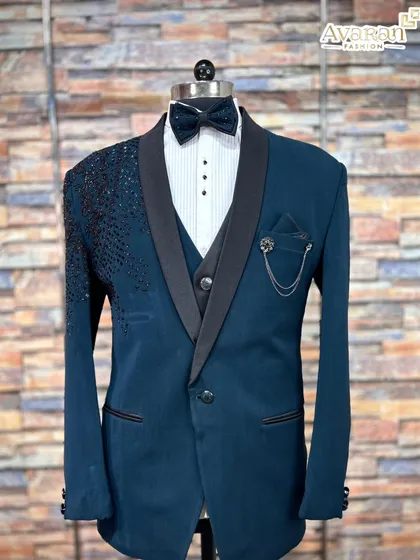 A complete look for the modern man. This five-piece Indo-Western suit in a sharp teal blue is perfect for a reception or engagement party. The rental includes the embellished jacket, waistcoat, shirt, trousers, and a matching bow tie.