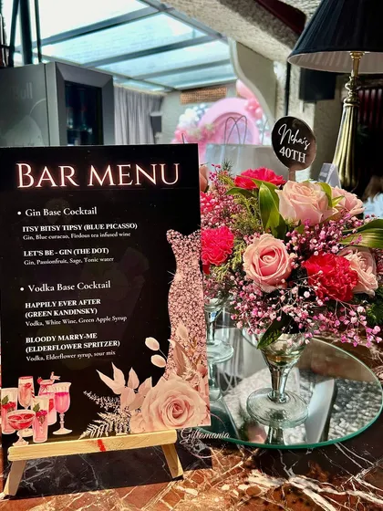 A personalized bar menu designed for a "Forty & Fabulous" themed birthday party. This detail shows how I coordinate every element, from custom event stationery and signage to the floral arrangements, ensuring a cohesive and high-end experience.