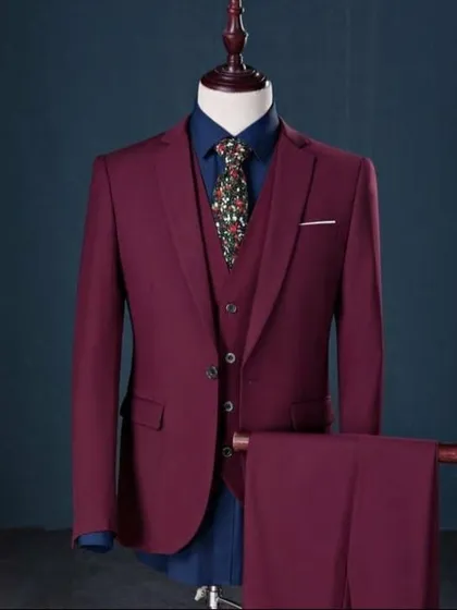This deep maroon three piece suit is an excellent choice for a groom or for attending a wedding. Displayed on a mannequin to show its precise cut and structure, this is a style I can recreate for you with a fabric of your choice.