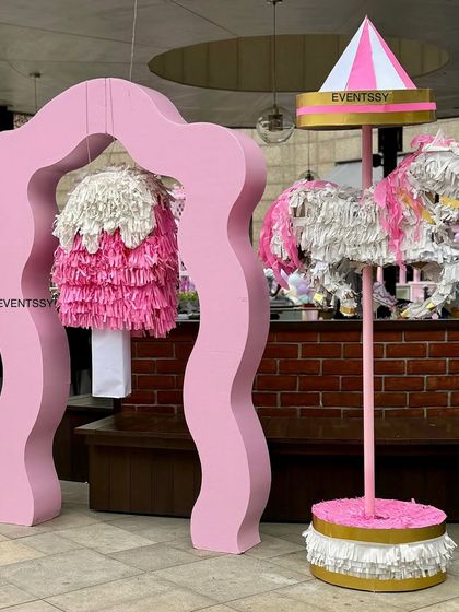 A fun piñata station with a custom-made carousel horse piñata, ready for the party games to begin.