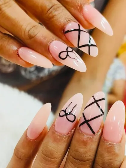 A playful and chic design with a sheer pink base, black corset-style lines, and delicate bow art.