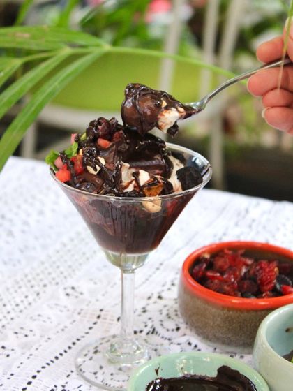 Our homemade Chocolate Sundae is a chocolate lover's dream. It has a layer of sweet potato brownie, vegan vanilla and chocolate ice cream, and a generous drizzle of chocolate sauce.