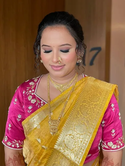 A serene close-up of the bride. The soft eyeshadow and perfectly applied liner enhance her eye shape beautifully.