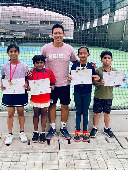 A group of our junior champions with their certificates and medals after a weekend UTR event. We encourage participation in friendly competitions to build experience and confidence.
