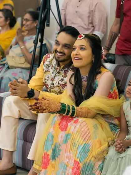 The couple enjoying the performances at their Sangeet ceremony.