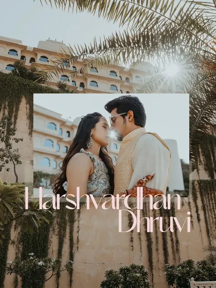 A romantic, sun-flared couple portrait from a Haldi event in Udaipur, with a palace-like hotel in the background.