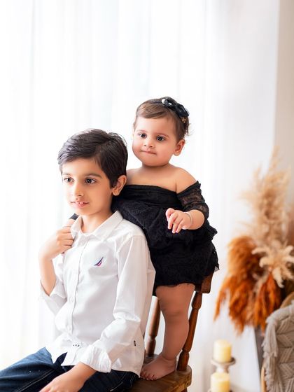 A candid moment between siblings. I love capturing these unposed interactions that show the real relationship between brothers and sisters.