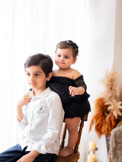 A candid moment between siblings. I love capturing these unposed interactions that show the real relationship between brothers and sisters.