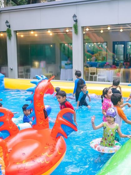A candid moment of kids and adults enjoying the pool together. I design my parties to be fun for the entire family.