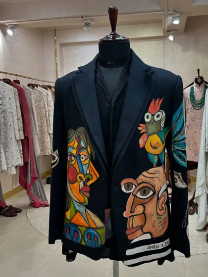 Art you can wear. This hand-painted blazer from Jatin Malik Couture is for the groom who isn't afraid to make a statement. It's a true masterpiece.