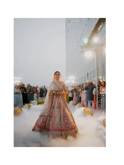 The bride's entrance is a moment suspended in time. I used a low-angle shot with theatrical smoke to create this ethereal, almost magical atmosphere, making her look like she's floating toward her future. It’s about making the grand moments feel deeply personal and unforgettable.