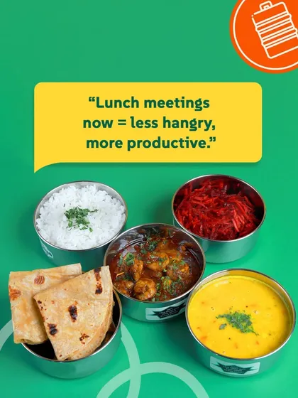 Lunch meetings are now less hangry and more productive with our balanced veg tiffins. This one has a tasty shrimp curry, dal, rice, salad, and rotis. Wait, that's not veg! Let's call it a delicious meal.