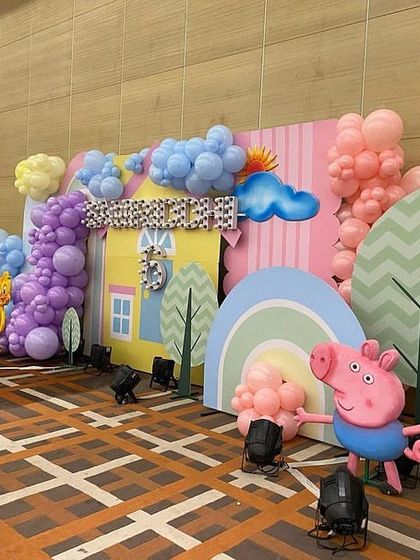 A cheerful Peppa Pig backdrop for Samriddhi's 6th birthday, with colorful balloon clouds and cutouts of Peppa, George, and their friend, the little chick.