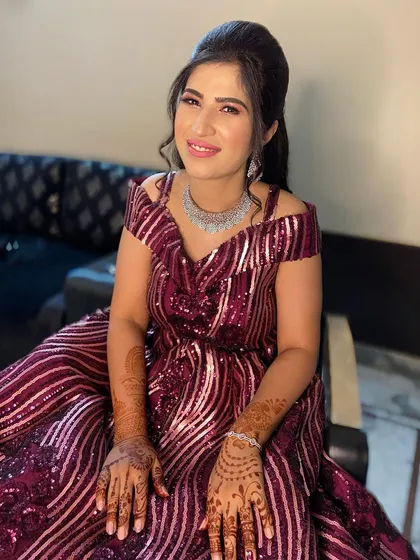 A beautiful party look for an evening function. I gave her a soft smokey eye and a pink lip to complement her sequined maroon gown.