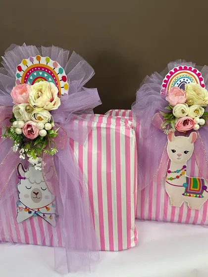 Our 'No Drama Llama' theme extends to return favors too. These beautifully wrapped gifts are adorned with cute llama cutouts and colorful ribbons, perfect for a baby shower.