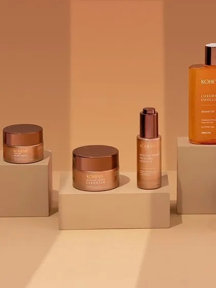 A simple and effective shot of a skincare line, using parallel shadows to add a graphic element. The neutral color palette gives the image a clean, sophisticated, and almost scientific feel.