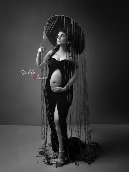 The black and white version of the artistic "rain" portrait. This edit emphasizes the unique shapes and textures of the headpiece and the model's striking pose.