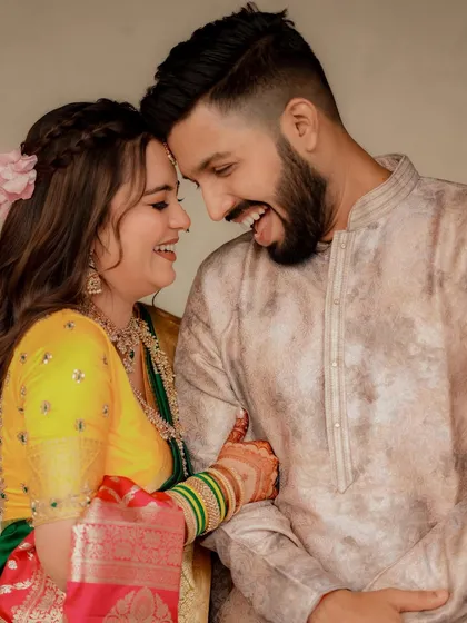 A moment of pure, uninhibited laughter between the couple.