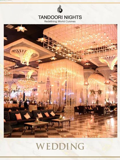 The epitome of a grand celebration. This image shows a reception hall with breathtaking crystal chandeliers and elegant lounge seating, an environment where our luxury catering feels right at home.