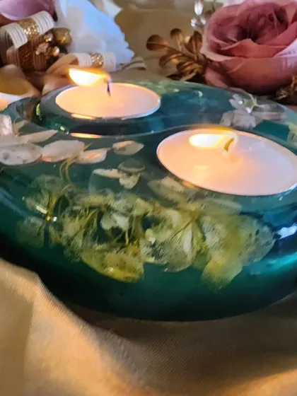 This Diwali, gift your loved ones this classy and elegant tealight candle holder. This one is made with teal resin and preserved white flowers.