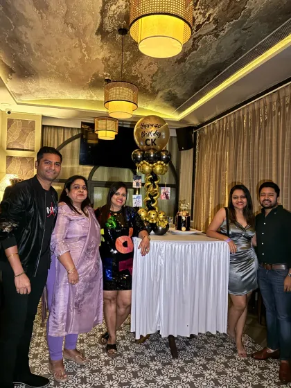 Guests enjoying the sophisticated ambiance of the 40th birthday party. The decor is designed to be elegant and festive, suitable for adult celebrations.