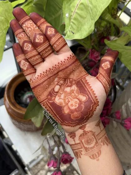 The best part is seeing the beautiful stain! I use natural henna to make sure you get this gorgeous, deep reddish-brown color. This is the result of a Ganesha design after the paste has been removed.