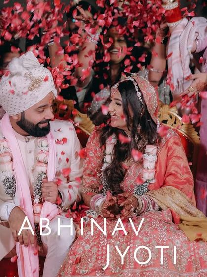 A joyous moment as the couple is showered with rose petals by their loved ones after the ceremony.