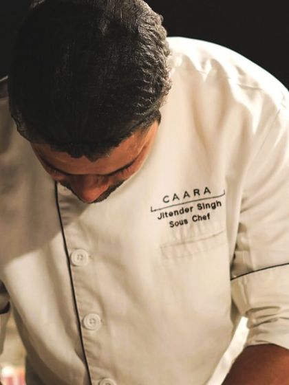 Our Sous Chef, Jitender Singh, meticulously plating a dish. His passion and attention to detail are a huge part of our success.