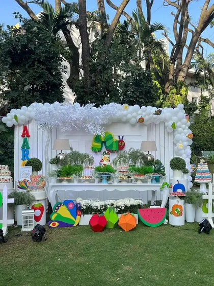 I transformed this outdoor space into a vibrant world based on 'The Hungry Caterpillar' for a second birthday. This full event setup shows how I combine large props, a themed dessert table, and personalized details to create a completely immersive experience for your child.