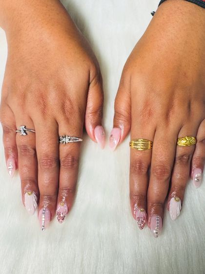 A full view of the hands, showing how the different art on each nail comes together for a cohesive, stunning bridal look.