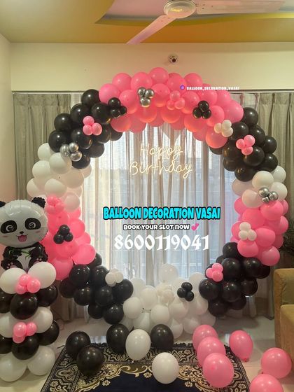A cute panda theme for a birthday at home. This ring decoration in pink, black, and white is simple, stylish, and perfect for animal lovers.