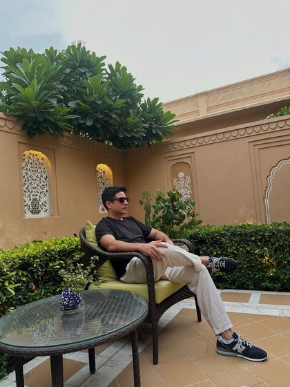 Relaxing in a quiet courtyard in Jaipur before a big event. Taking a moment to chill and get centered is key to delivering a high-energy performance.