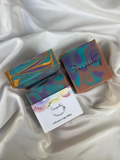 A collection of some of my favorite soap bars, including Vetiver, A Thousand Wishes, and Volcano Capri Blue. Each one has a unique scent and beautiful design.